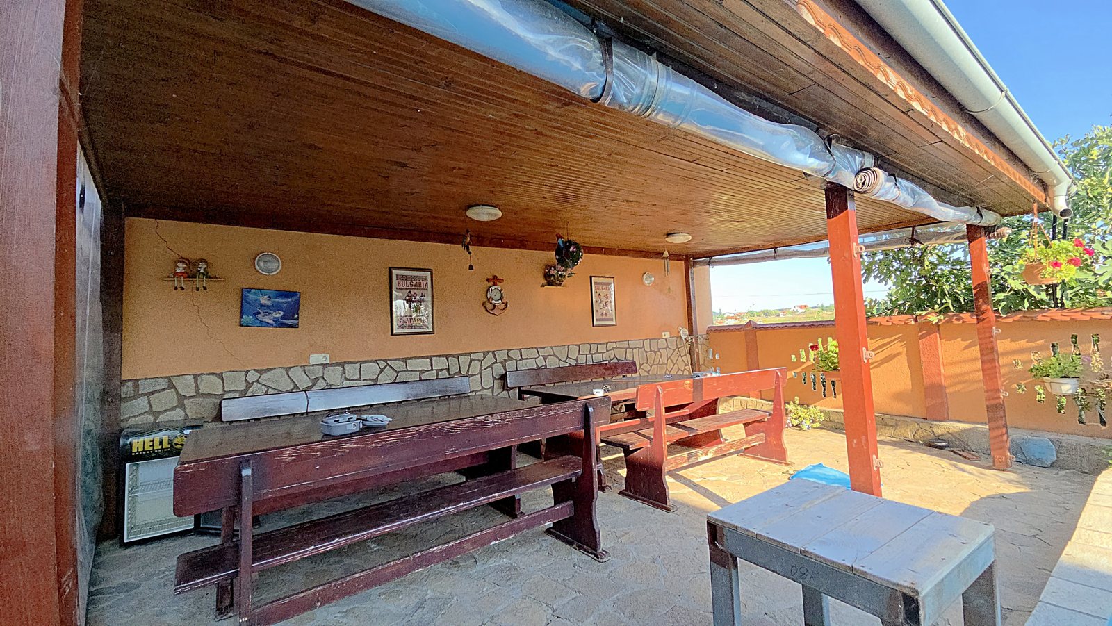 Photo 099 · Covered outdoor dining and BBQ area